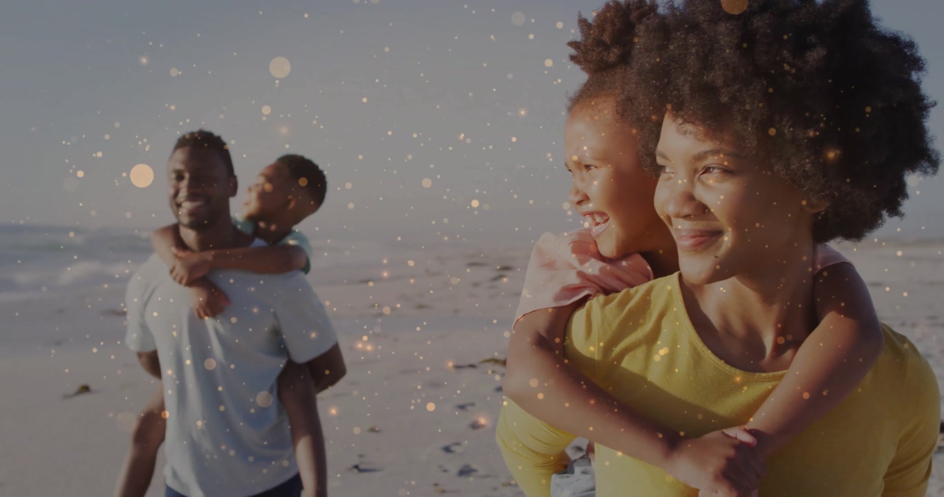Parents carrying kids piggyback walking shore while golden particles appearing over travel imagery