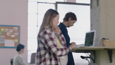 young-caucasian-businessman-using-digital-tablet-computer-working-online-brainstorming-entrepeneur-riding-gyroscooter-in-vibrant-trendy-office-workplace