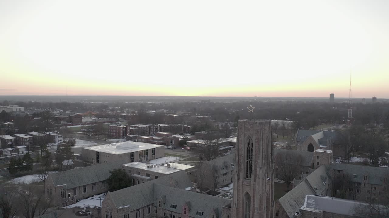 subida aérea sobre el seminario concordia durante la puesta de sol