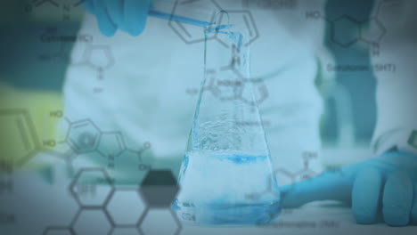 Laboratory-beaker-and-test-tube-with-data-and-structural-formula-of-chemical-compounds-in-the-foregr