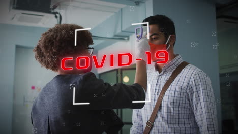 animation of covid 19 cells text over man having temperature checked in office wearing face mask