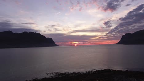 Aerial-of-a-fjord-at-sunset-on-Lofoten,-Norway