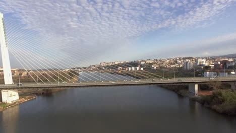 The-Beautiful-and-Peaceful-View-Of-Rainha-Santa-Isabel-Bridge-in-Coimbra,-Portugal---Aerial-Shot