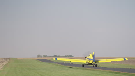 Crop-Duster-Plane-Taking-Off-from-Rural-Runway-to-Seed-Farm-Field