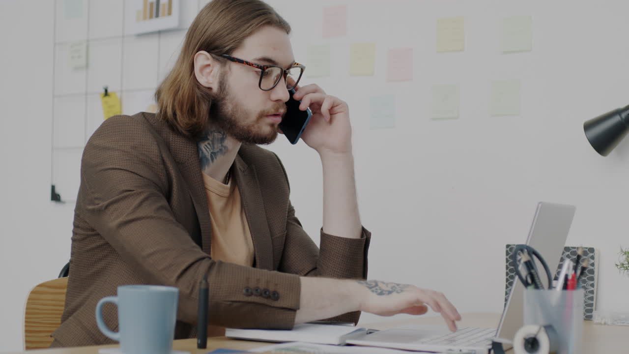 Businessman on Phone Call at Desk
