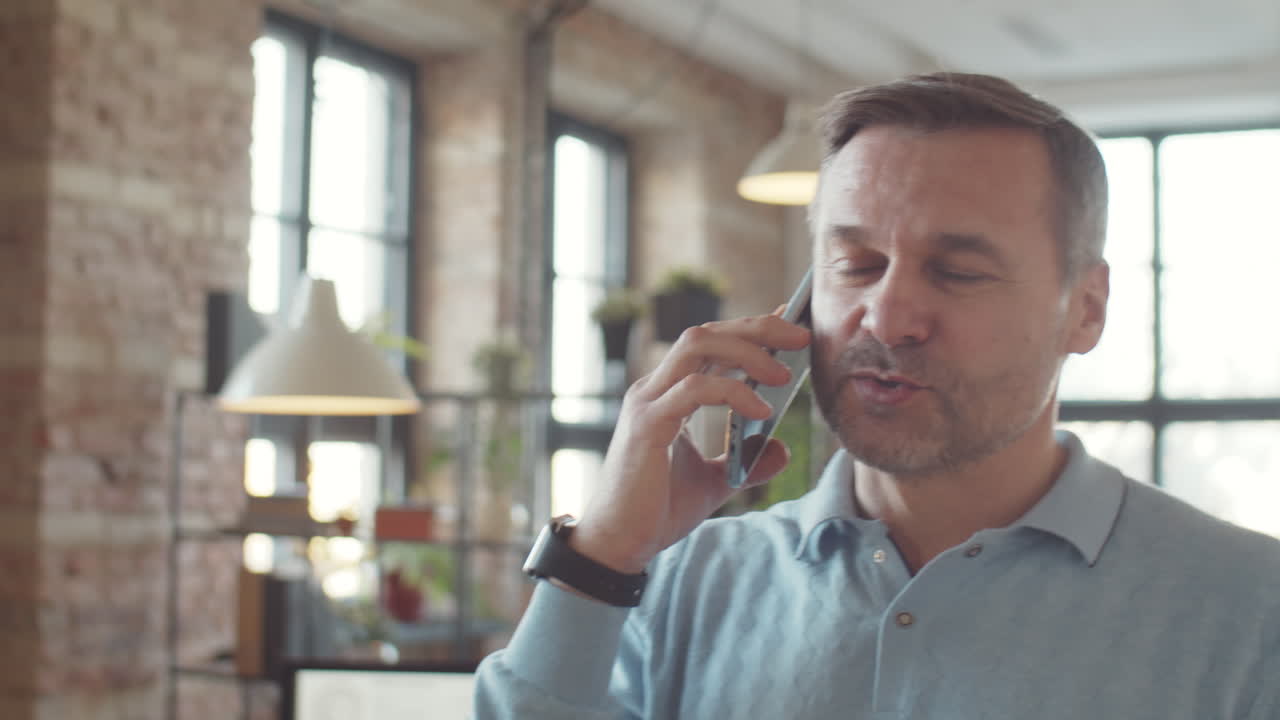 Man on a phone call in an office