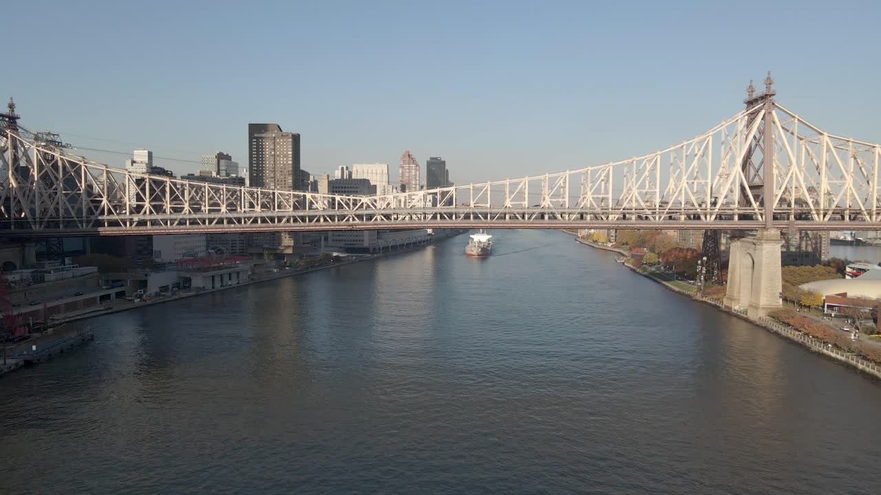 Aerial approaching Ed Koch Queensboro Bridge connecting  Manhattan to Queens over East River, New York City