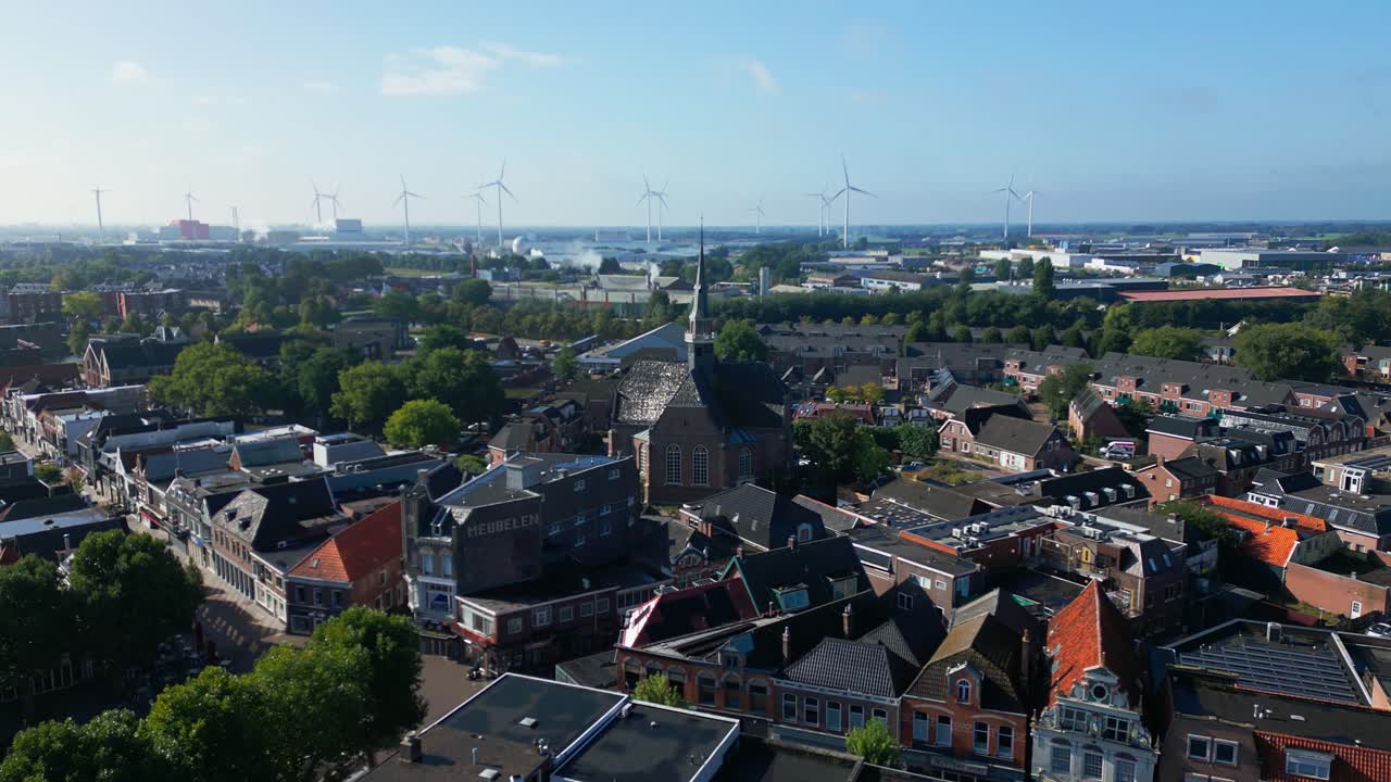 Elevated aerial shot showing Coevorden skyline with church tower and dense rooftops extending to horizon. Captured in Coevorden, Drenthe, Netherlands (Coevorden, Drenthe, Nederland)