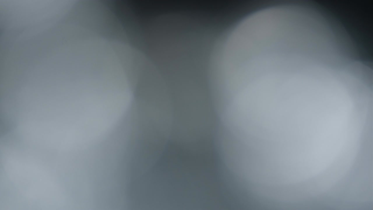 Abstract light leaks on black background.