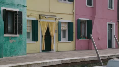 colorful facades of burano's historic homes, venice italy