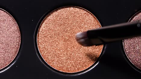 painting gold colored on make-up palette