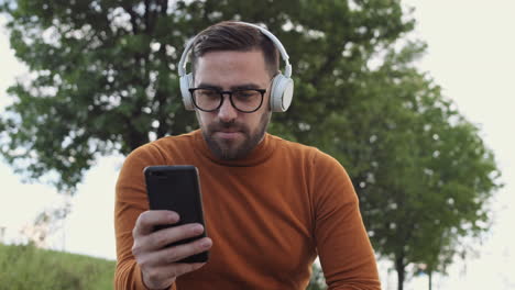 man in headphones listening to music