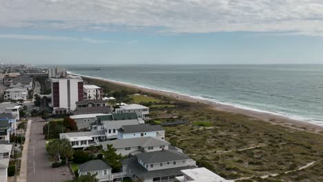 Aerial-video-of-flight-over-hotels-at-beach-and-water-tower