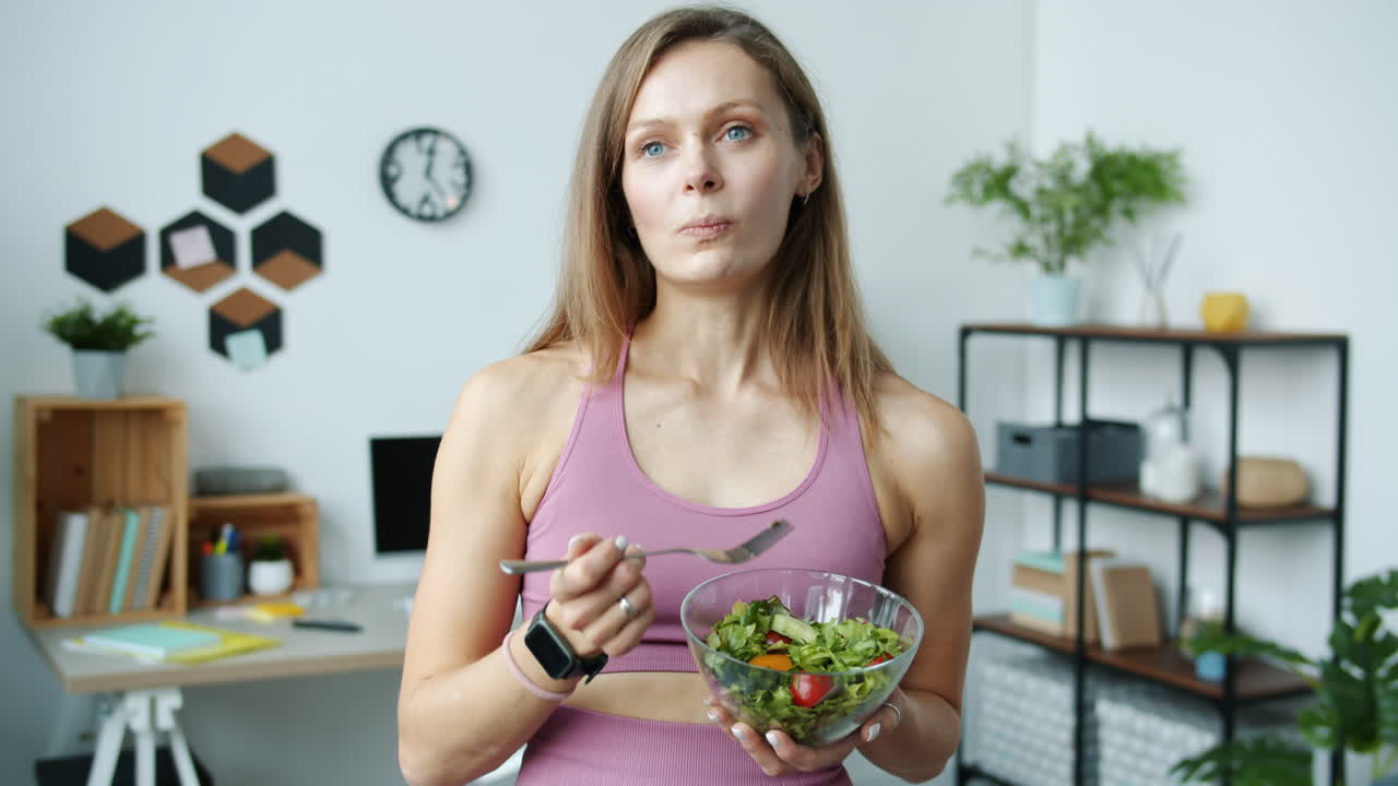 Woman Eating a Salad in a Home Office
