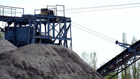 industrial stone production. industrial background with working gravel crusher