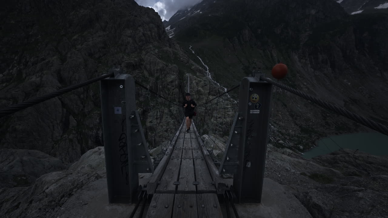 Hiking on a Suspension Bridge in the Mountains