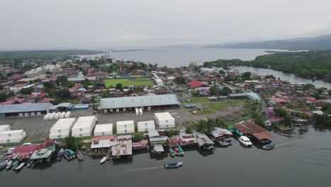 aerial view of a bustling coastal town and port facilities