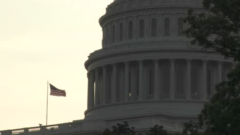 pull back from the capitol building in washington dc with an american flag visible