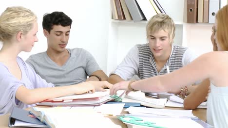 teenagers doing homework in the library