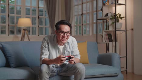 young guy gamer have fun while playing a game at home