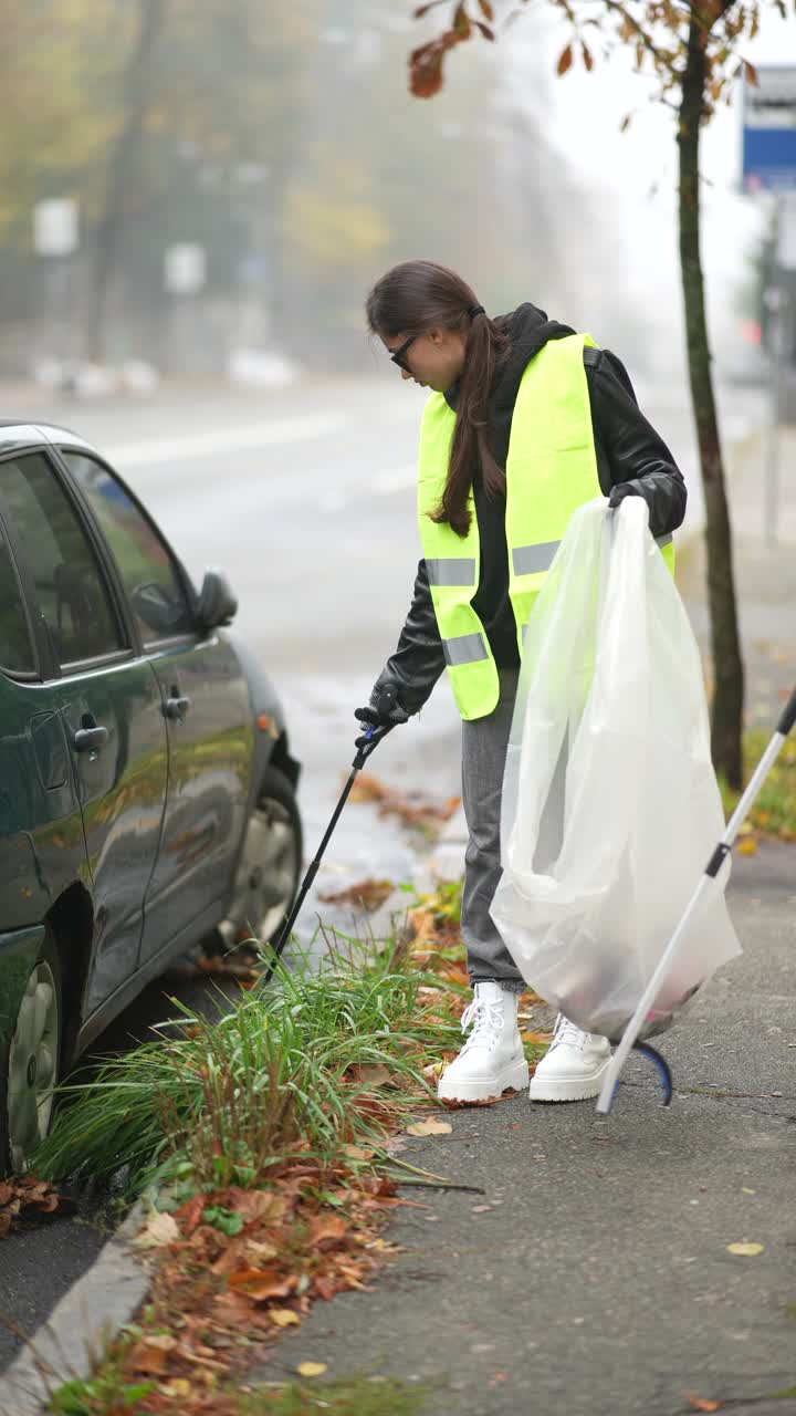 Woman Cleaning Up Litter on the Street
