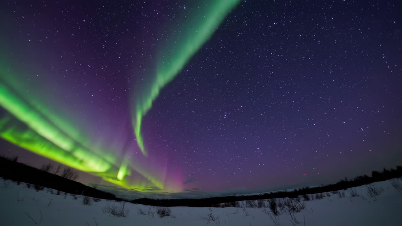 Aurora Borealis over Snowy Landscape