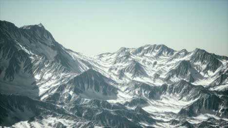 aerial view of the alps mountains in snow