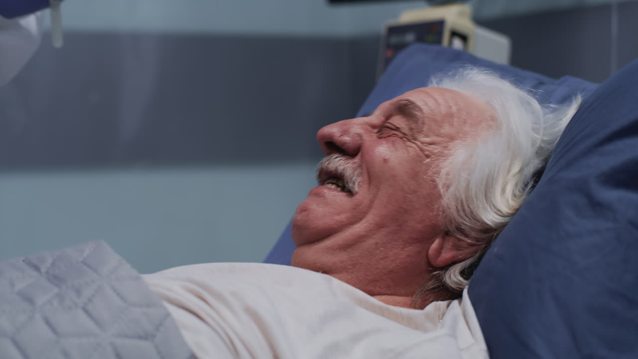 Healthcare worker performs a COVID-19 swab test on an elderly patient