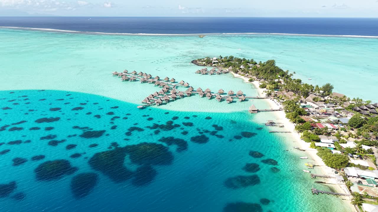 Drone Shot of Bora Bora Island, Luxury Resort With Overwater Bungalows, Lagoon in Shades of Blue, French Polynesia