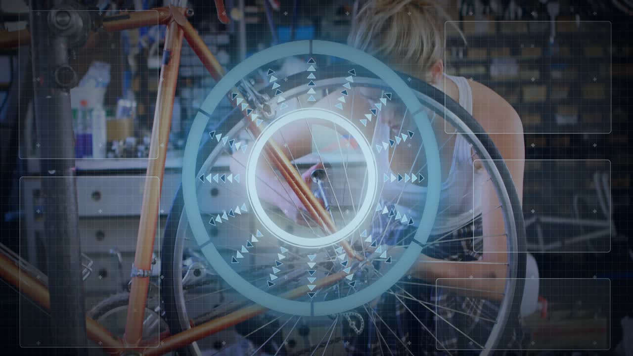Female bike mechanic gripping and rotating wheel in shop as overlay scanning spokes for alignment