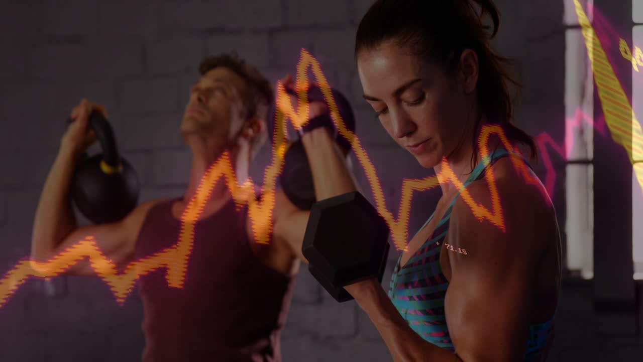 Man pressing kettlebell and woman curling dumbbell in gym, initiating pulsing graphs tracking reps