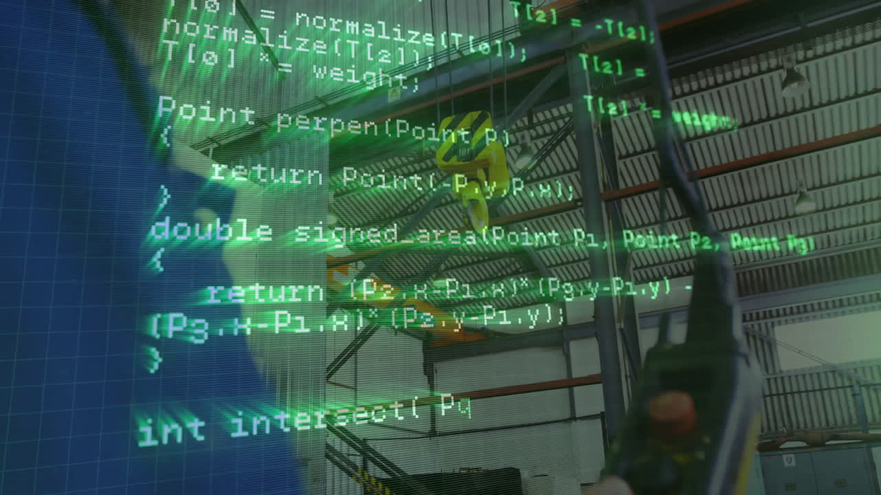 man gripping factory robot controller showing red stop button and joystick, with green code overlay