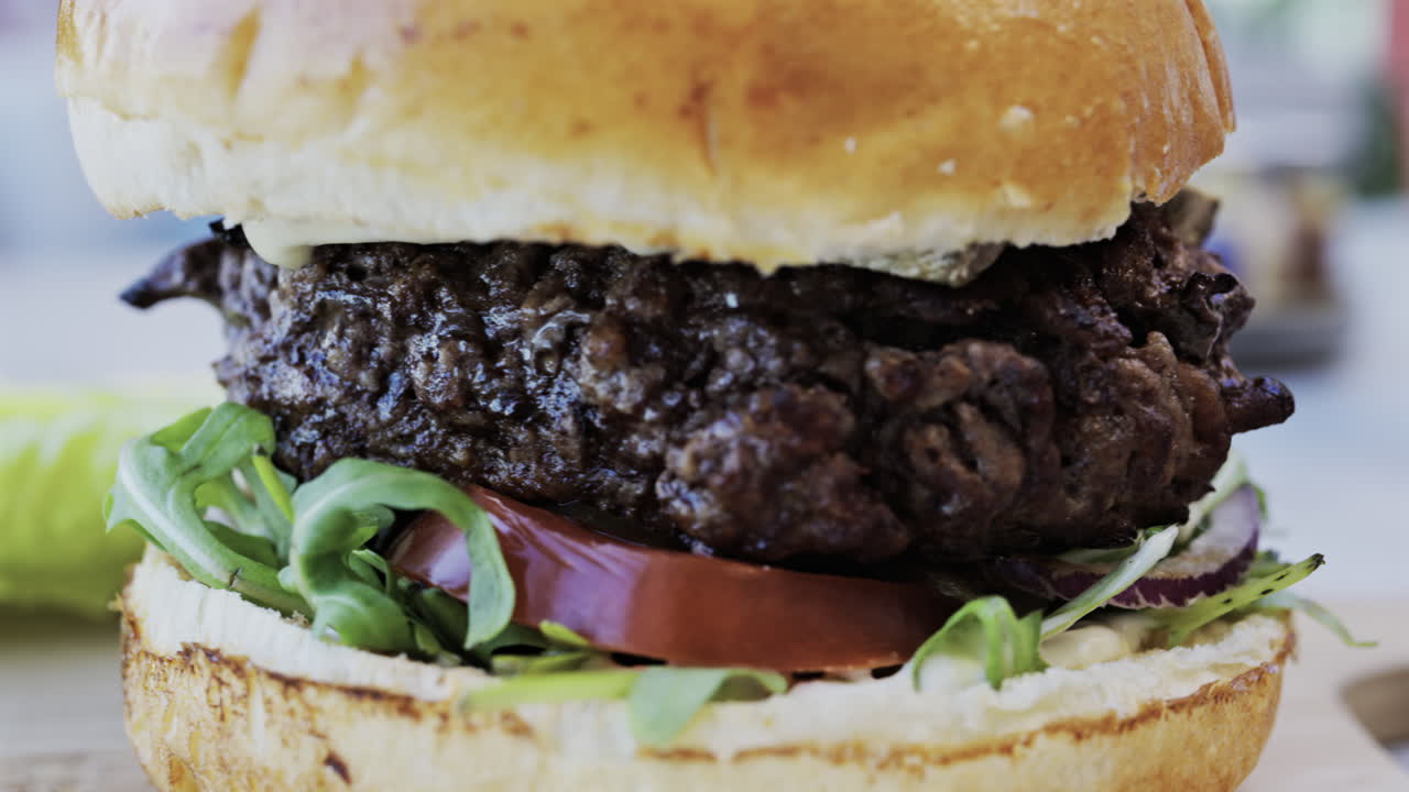 Close up of a hamburger on a plate at a restaurant