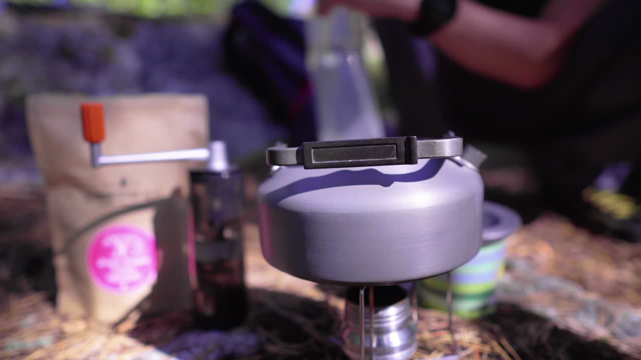 Water is poured into a backpacking kettle
