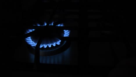 slide shot of a burner stove being put higher and lower