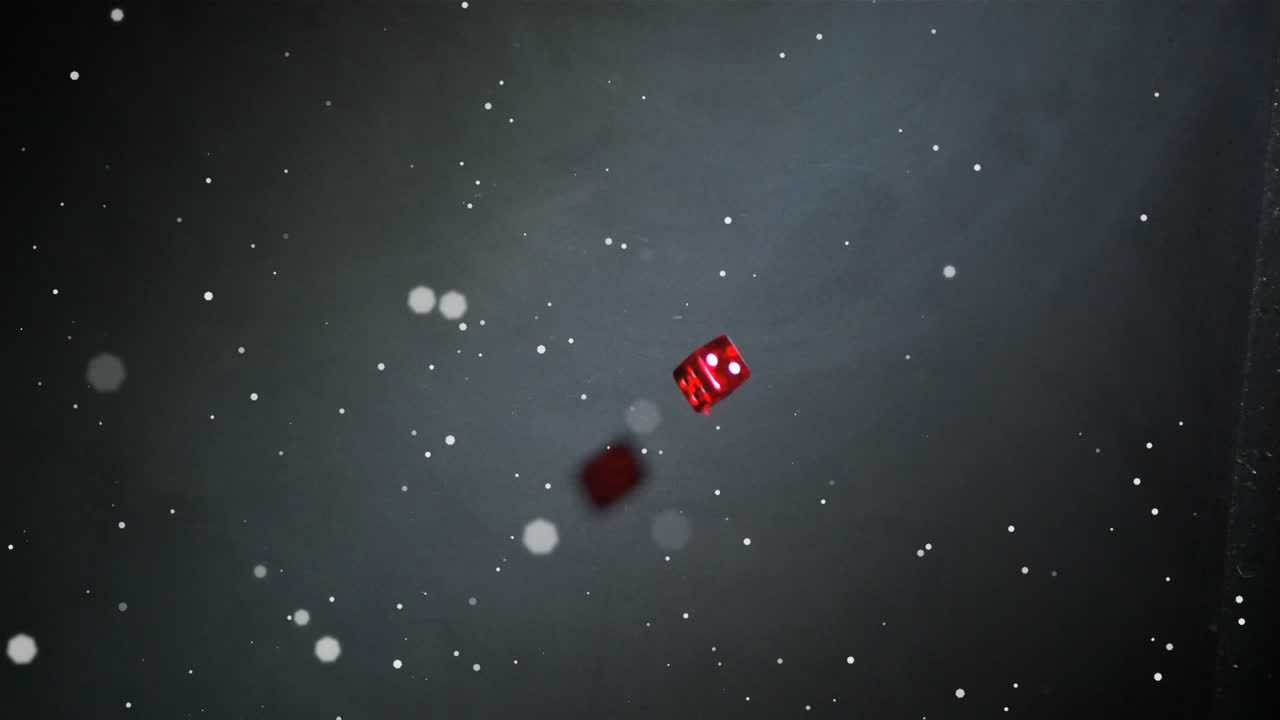 Animation of white dots floating over red dice falling and rolling, on black