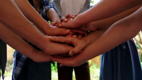 schoolkids forming hand stack in school premises 4k