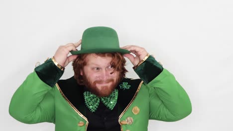 red headed man putting on hat full of gold coins st