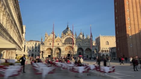 a crowd of tourists and locals spending the day at st. mark's square - hyperlapse