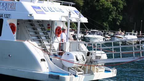 ferry approaches pier, crew prepares docking