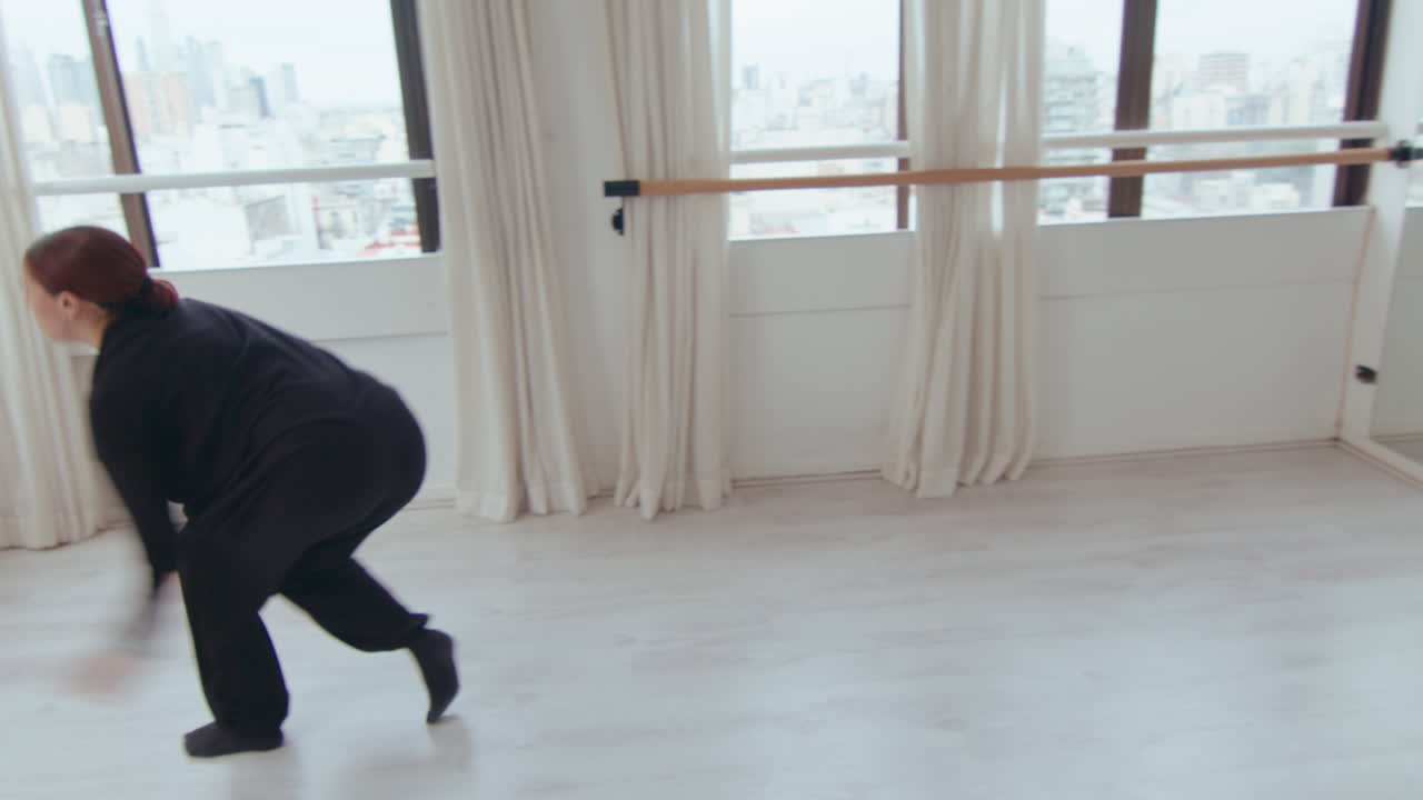 Inspired Female Performer Dancing Contemporary Style in Studio