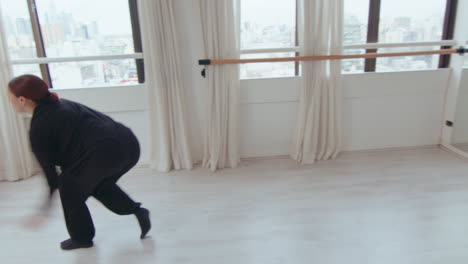 inspired female performer dancing contemporary style in studio