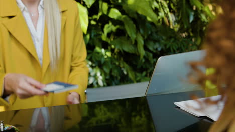 blonde receptionist working in a hotel