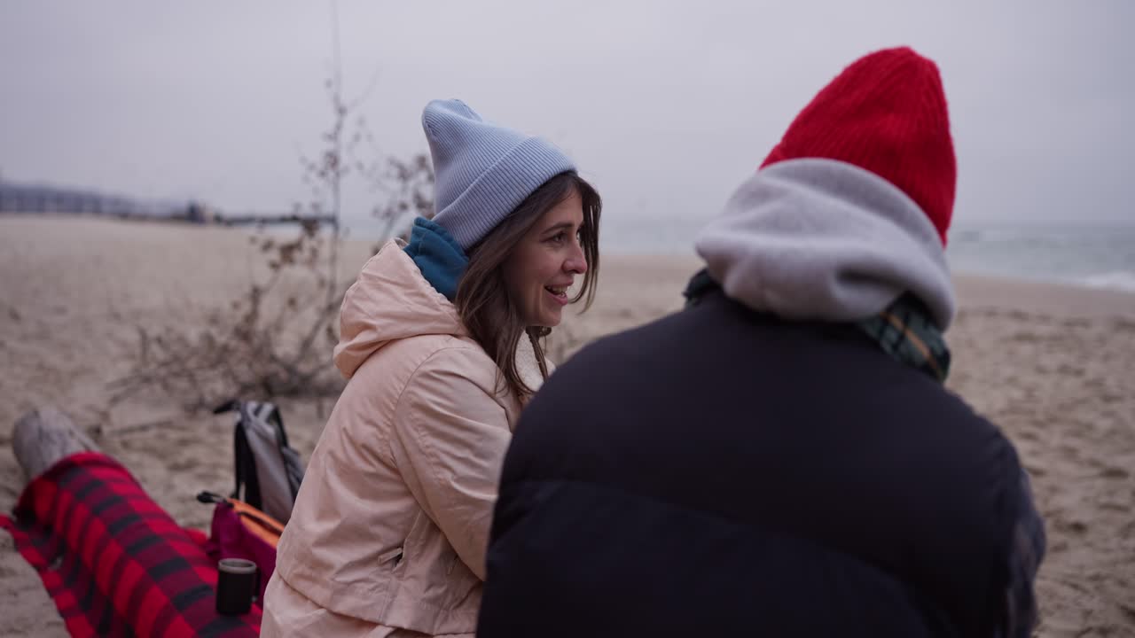 Couple enjoying the winter beach