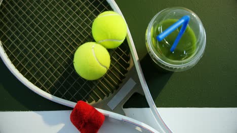 juice and sports equipment in tennis court 4k