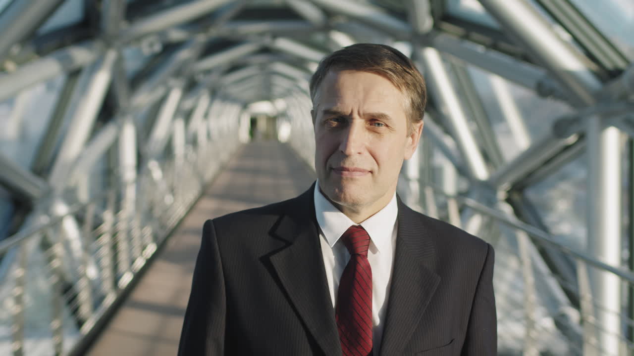 Portrait Of Successful Middle-Aged Business Man In Red Tie