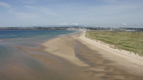 expansive sandy beach at tramore dunes on south coast of ireland