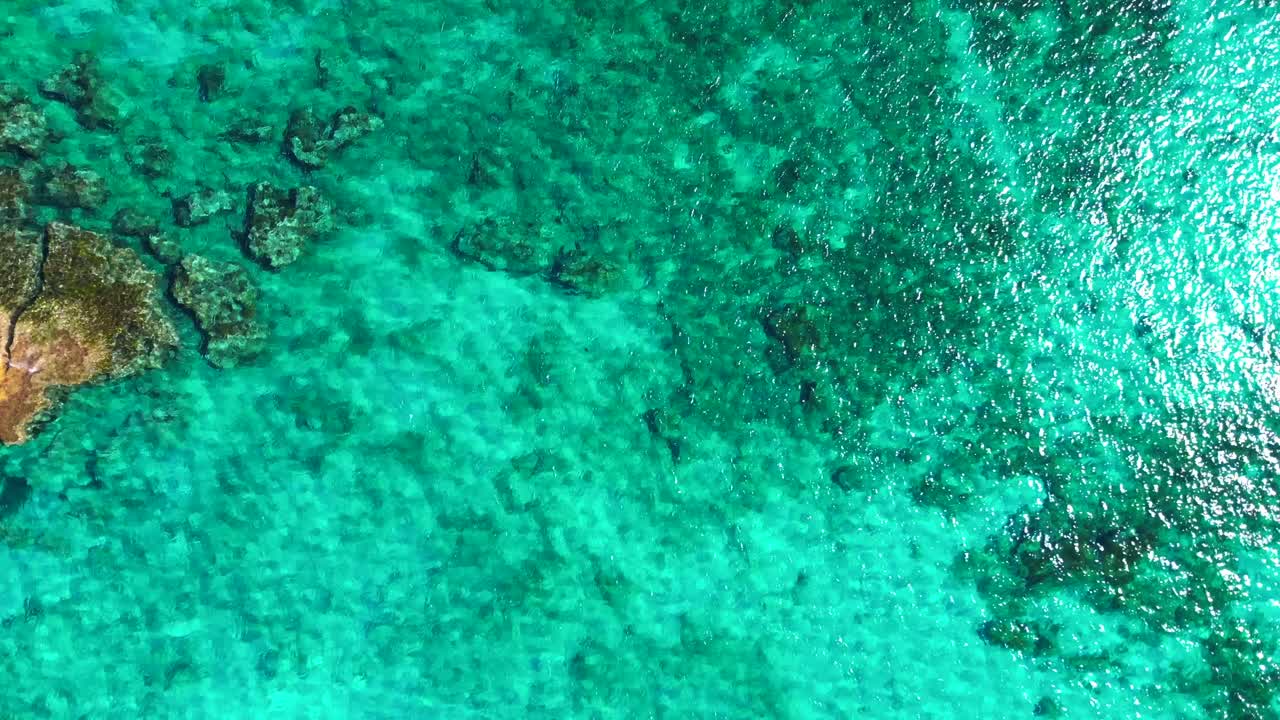 Formentera Ibiza seabed with vibrant turquoise water and underwater Posidonia oceanica seagrass beds. Fabulous aerial view flight drone camera pointing down