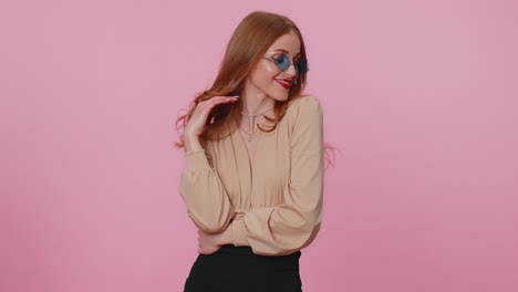 sincere cool cheerful brunette girl in beige blouse wearing sunglasses charming smile on pink wall