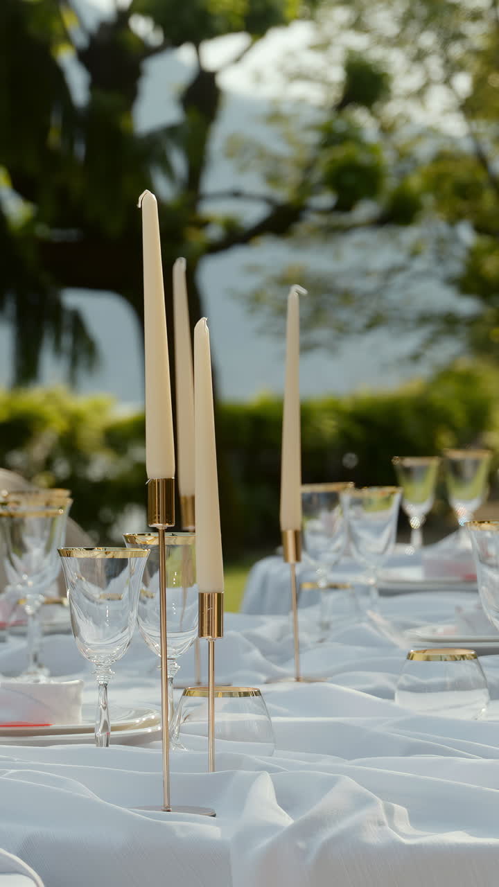 Elegant Table Setting with Candles and Wine Glasses